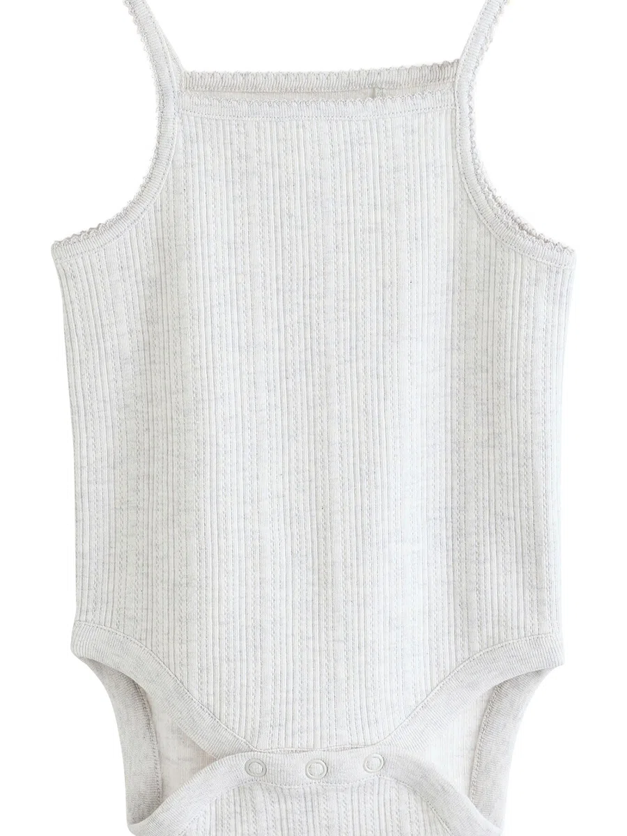 NEXT Bebés niña Pack de 5 bodis de tirantes sin mangas 100% algodón para bebé