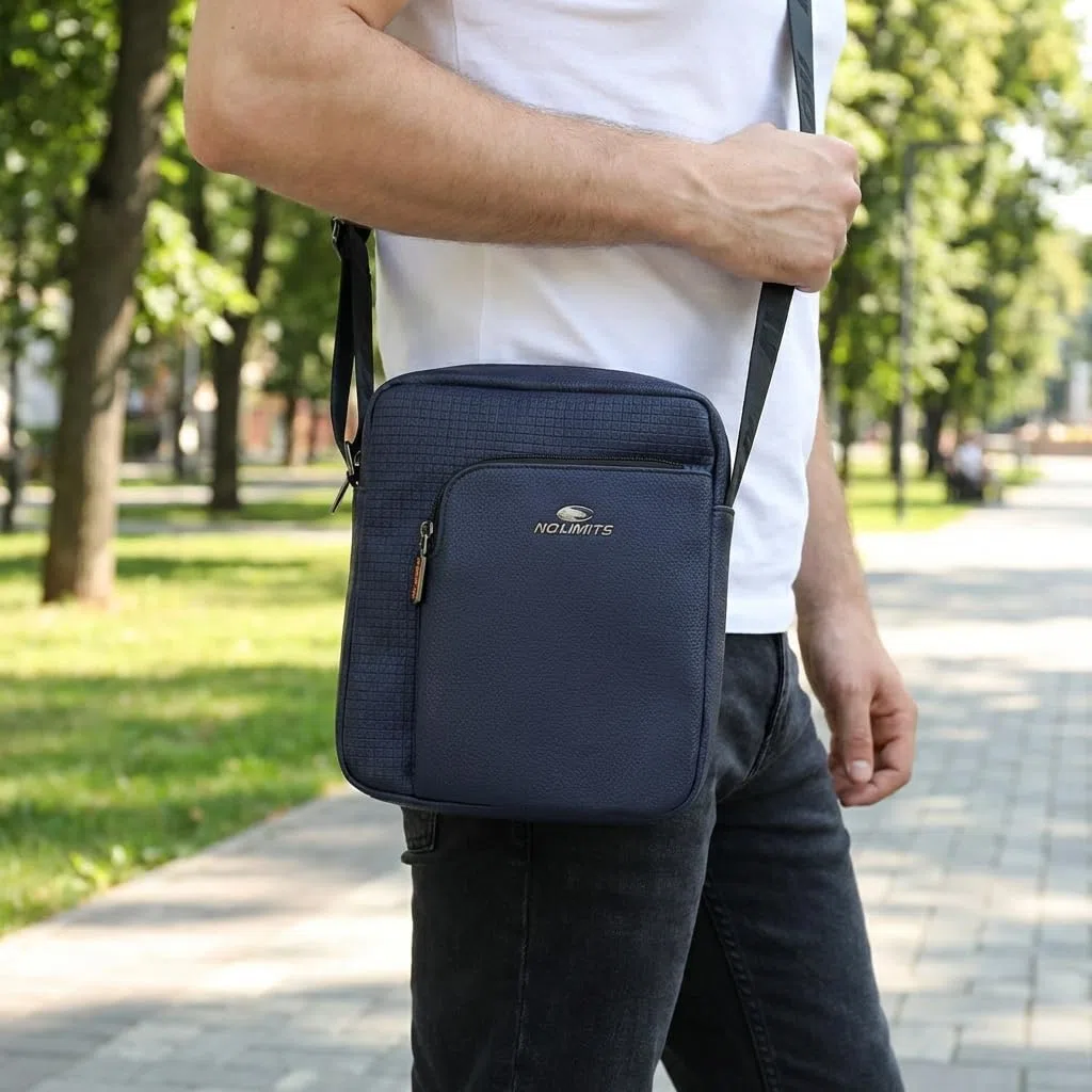 No Limits Bolso de hombre de bandolera ajustable, impermeable, con múltiples bolsillos y forro naranja, piel sintética